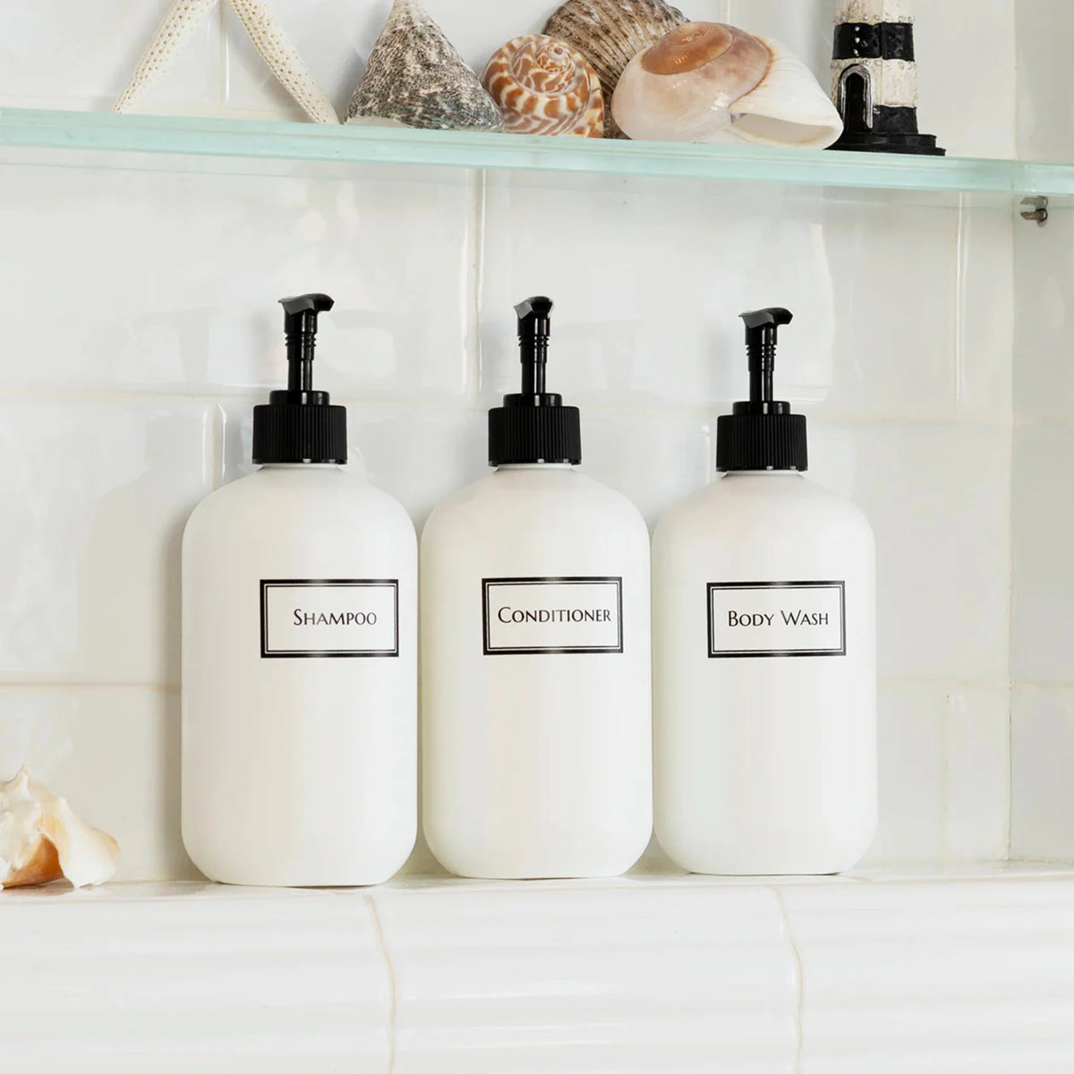 white refillable plastic shampoo bottle set with minimalist labels for bathroom renovation