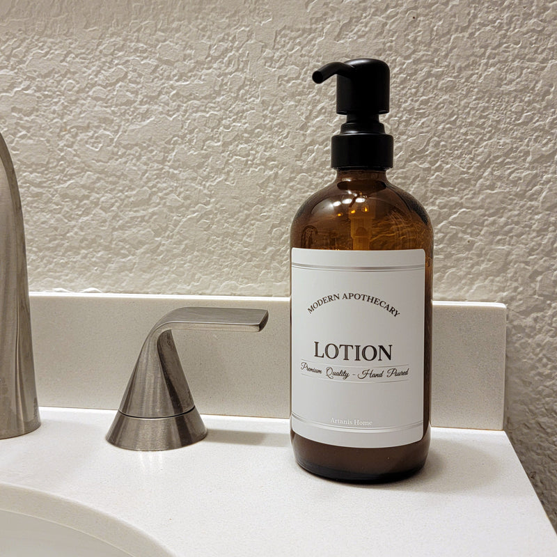 Amber glass refillable 16 oz Boston round pump bottle for lotion with black metal pump.