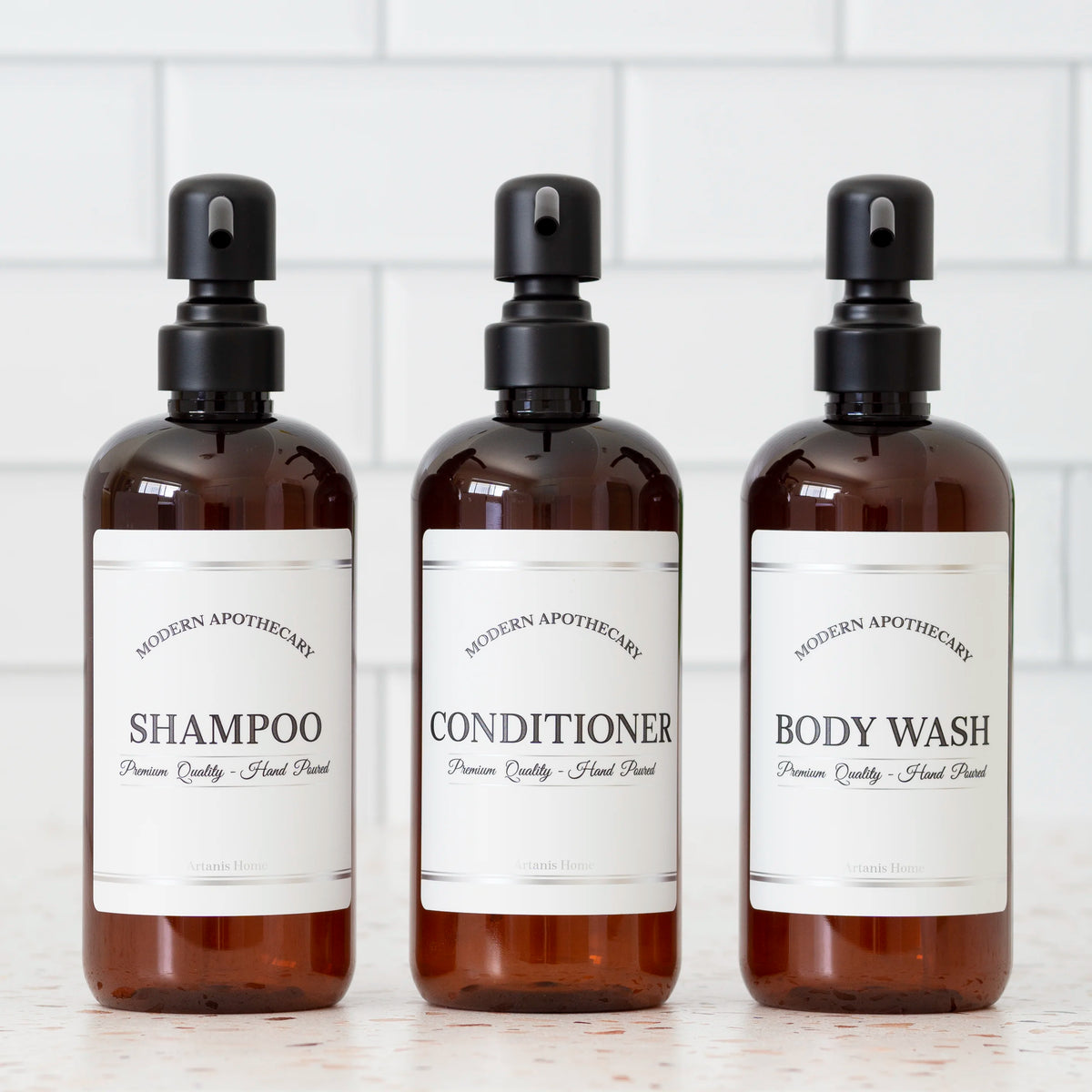 Amber PET set of refillable bottles with black satin pumps and coordinated labels for the shower.