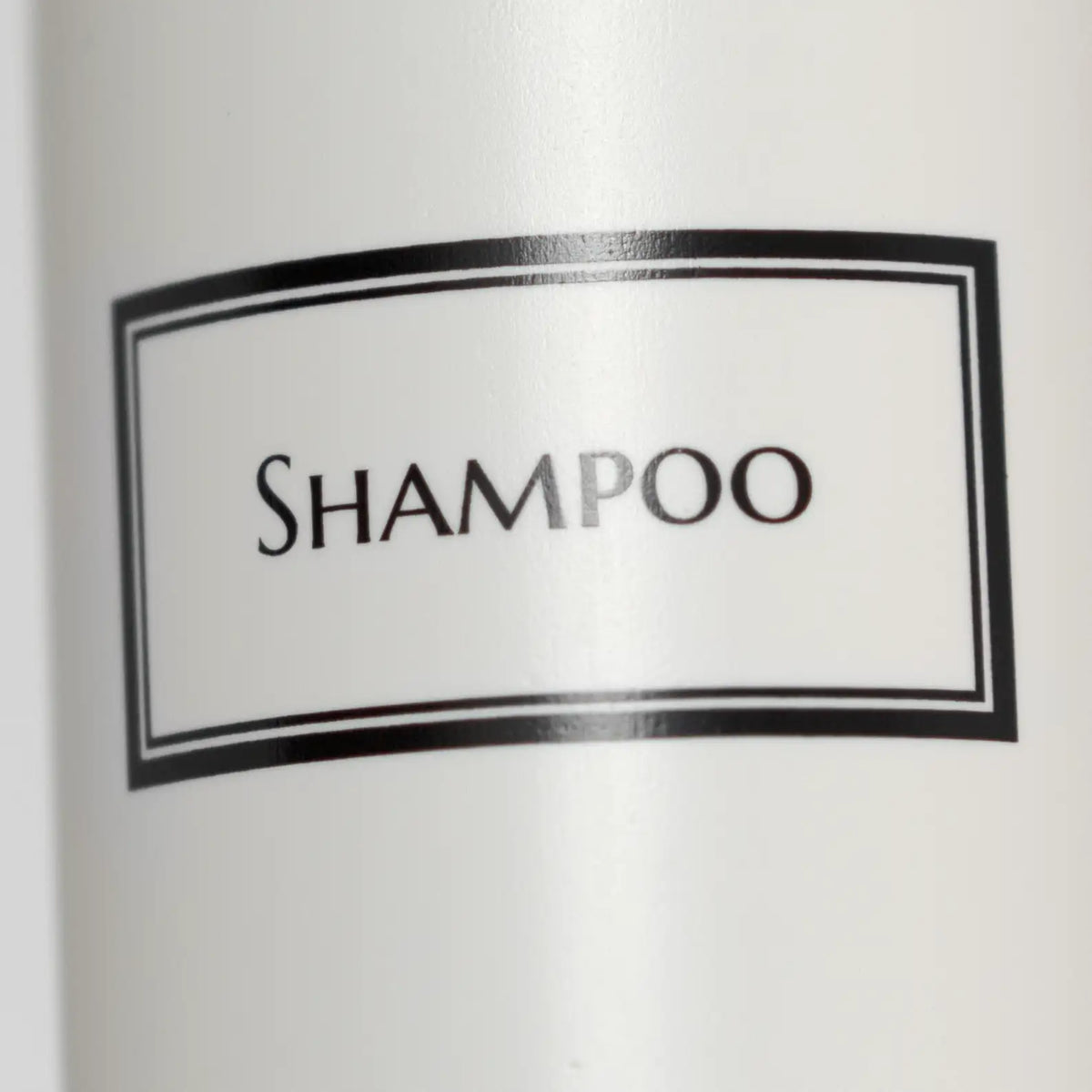 Close up of silkscreen print on white bottle.