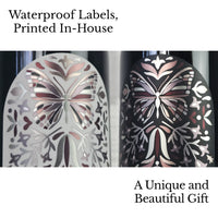 Super close up view of waterproof labels designed with metal butterfly design and matte laminate on Miron apothecary jars.