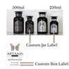 Four Miron apothecary jars with custom labels in black and white and with metal and holographic accents. Inset image of custom gift box label.