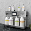 LIQUIFILL station filling various bottles from four gallon jugs on a gray marble surface.