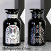 Two Miron apothecary jars with custom black and white holographic labels and butterfly design.