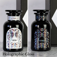Two Miron apothecary jars with custom black and white holographic labels and butterfly design.