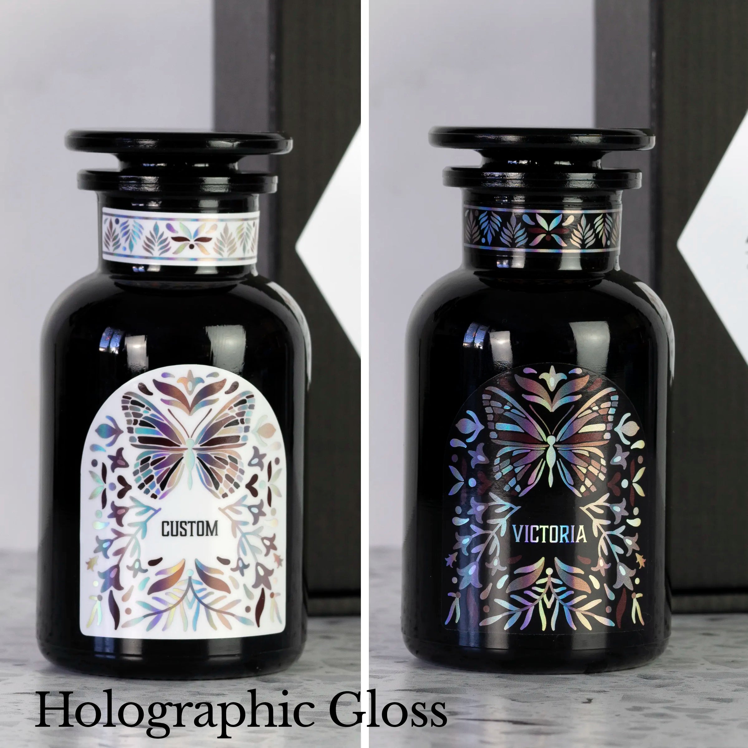 Two Miron apothecary jars with custom black and white holographic labels and butterfly design.
